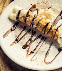 Homemade cannoli dessert at Delmonico's Italian Steakhouse Homemade cannoli dessert at Delmonico's Italian Steakhouse