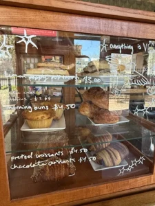 Displayed pastries at The Siren and the Sea Displayed pastries at The Siren and the Sea