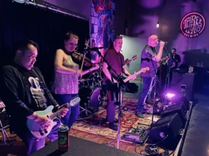 Live music performance at Three Heads Brewing